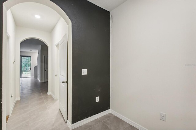 hall with light tile patterned flooring