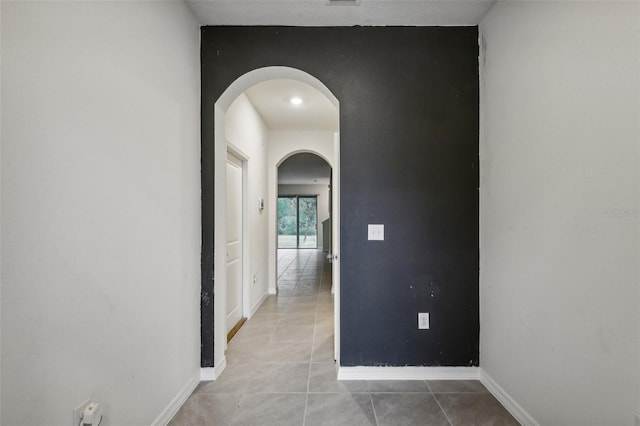 hall with light tile patterned flooring