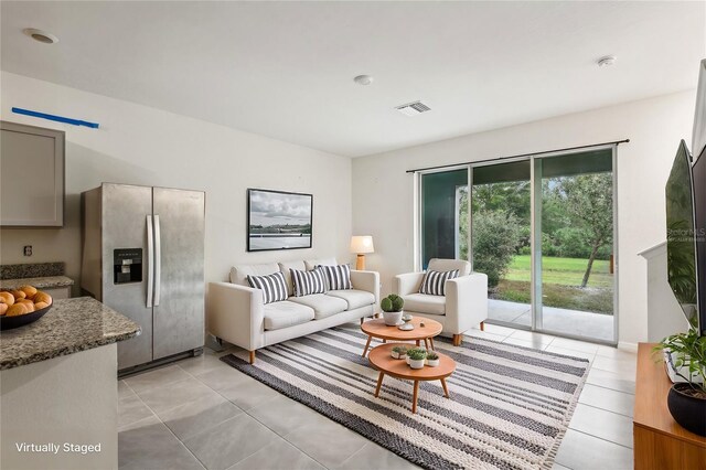 living room featuring light tile patterned flooring