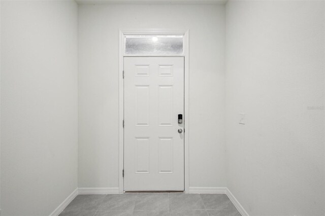 doorway to outside featuring light tile patterned floors