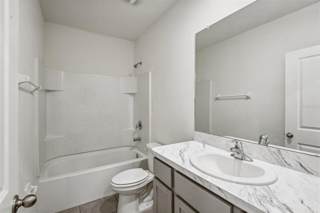 full bathroom featuring tile patterned floors, vanity, toilet, and tiled shower / bath