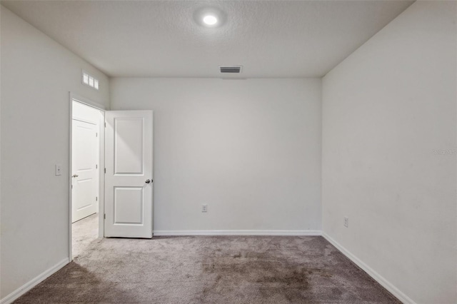 empty room with carpet floors