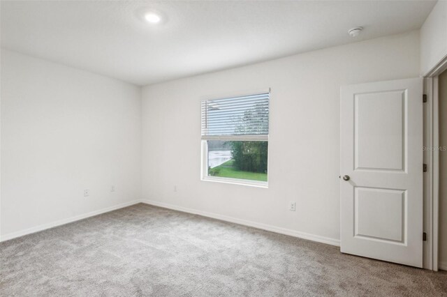 spare room with carpet floors