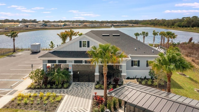 drone / aerial view featuring a water view