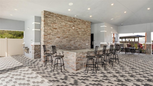 interior space featuring light tile patterned floors and a high ceiling