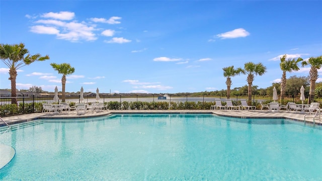 view of swimming pool with a patio