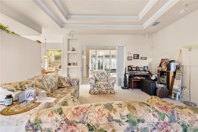 living room with a raised ceiling, light colored carpet, and ornamental molding