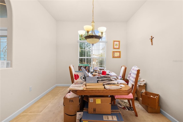 carpeted dining space with a notable chandelier