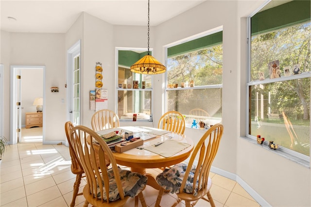 dining area with light tile patterned floors