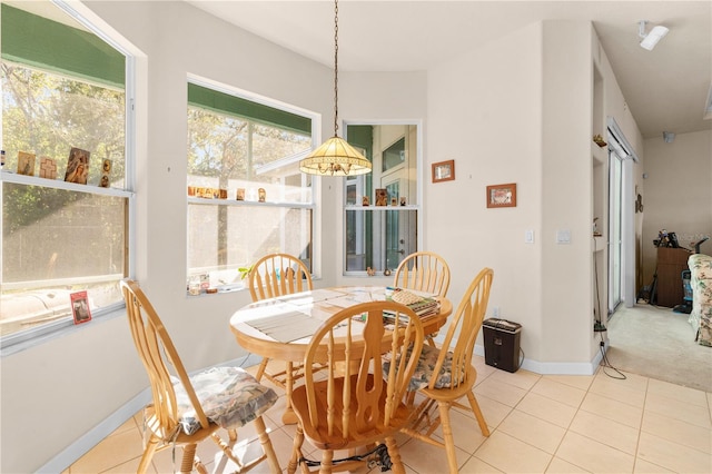 dining space with tile patterned floors