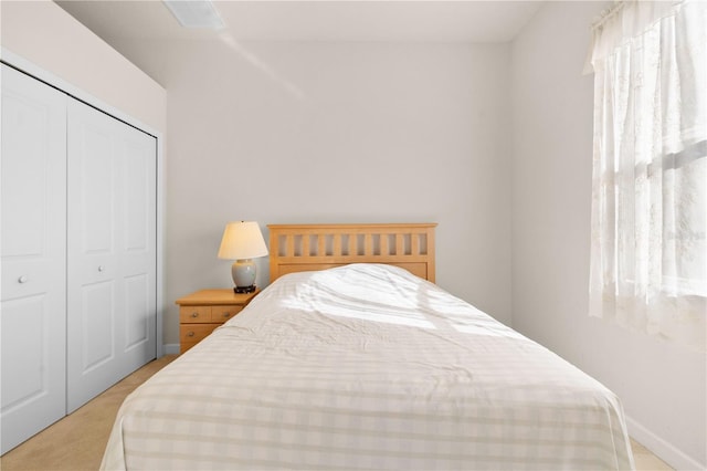 carpeted bedroom with a closet