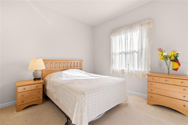 bedroom featuring light carpet