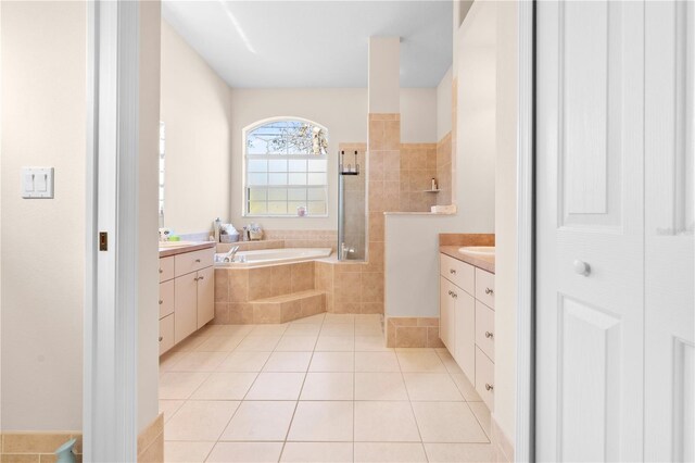 bathroom featuring vanity, tile patterned floors, and separate shower and tub