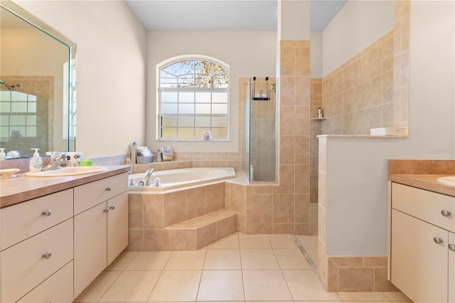 bathroom featuring tile patterned flooring, vanity, and independent shower and bath