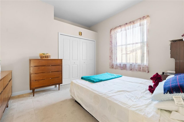 carpeted bedroom with a closet