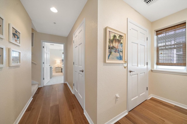 hall featuring wood-type flooring