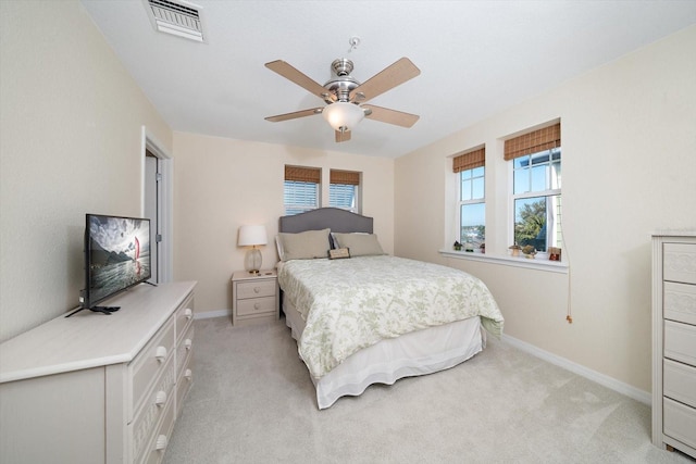 bedroom featuring ceiling fan and light carpet