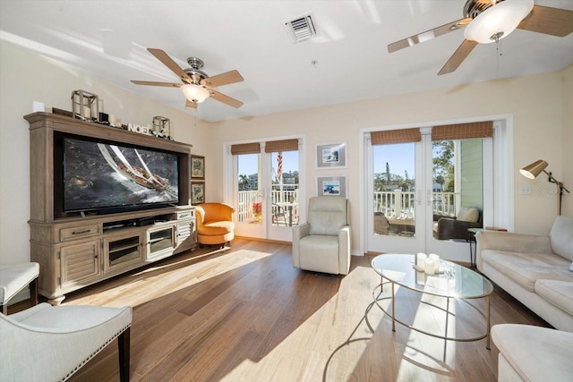 living room featuring light hardwood / wood-style floors and plenty of natural light