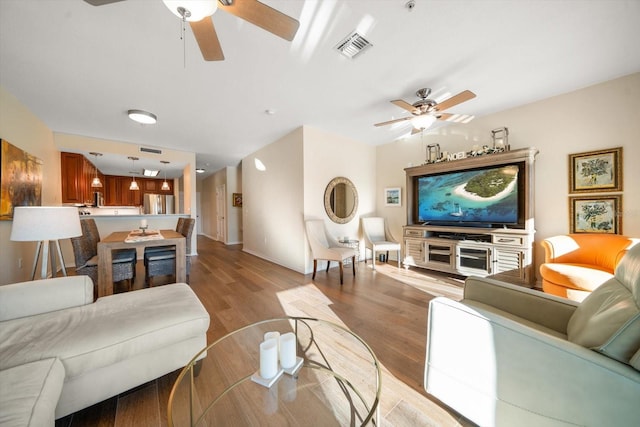 living room with light hardwood / wood-style flooring