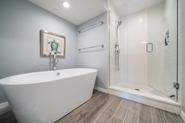 bathroom featuring plus walk in shower