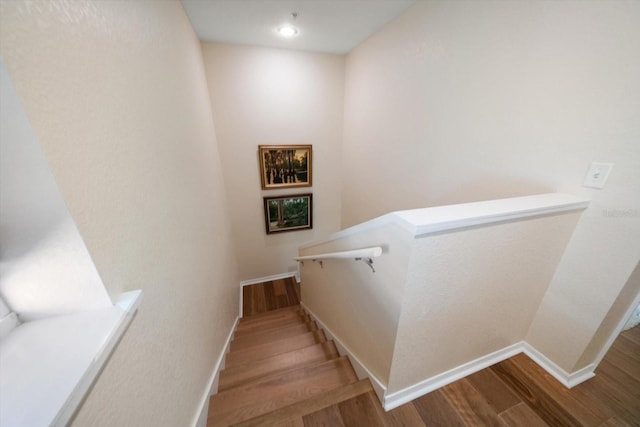 staircase featuring hardwood / wood-style floors