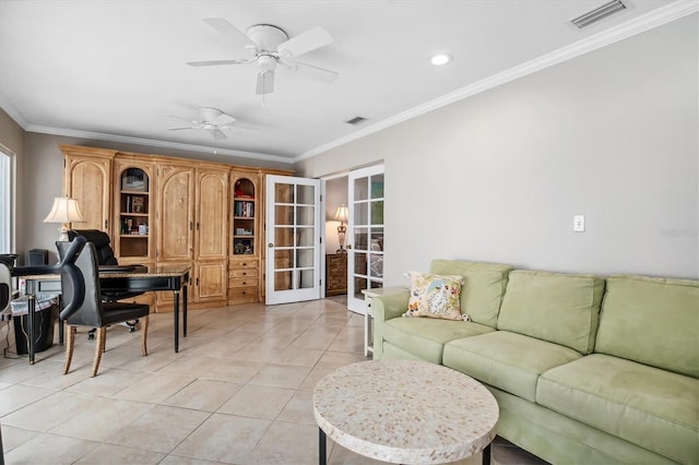 tiled living room featuring crown molding, french doors, and ceiling fan