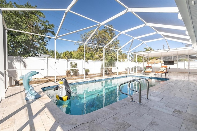 view of swimming pool featuring a patio area and a lanai