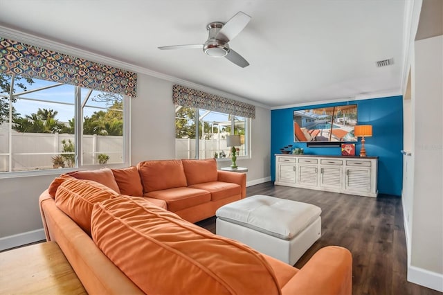 living room featuring hardwood / wood-style flooring, ceiling fan, and crown molding