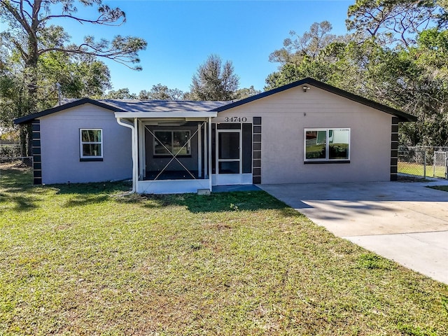 ranch-style house with a front lawn