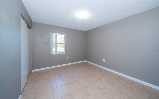 empty room featuring a textured ceiling