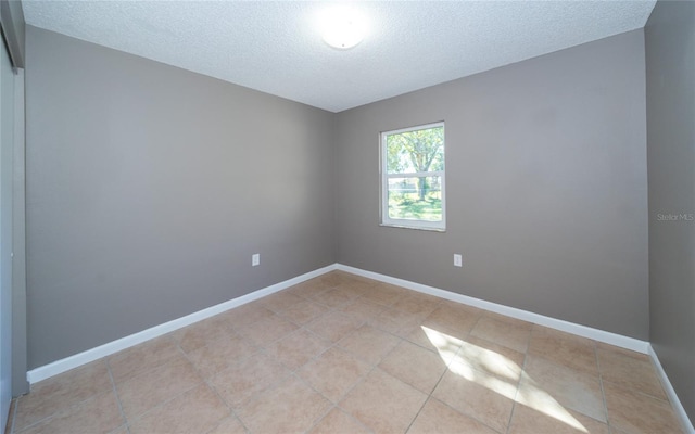 empty room with a textured ceiling