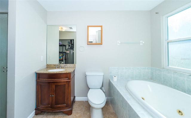 bathroom featuring vanity, toilet, plenty of natural light, and tiled tub