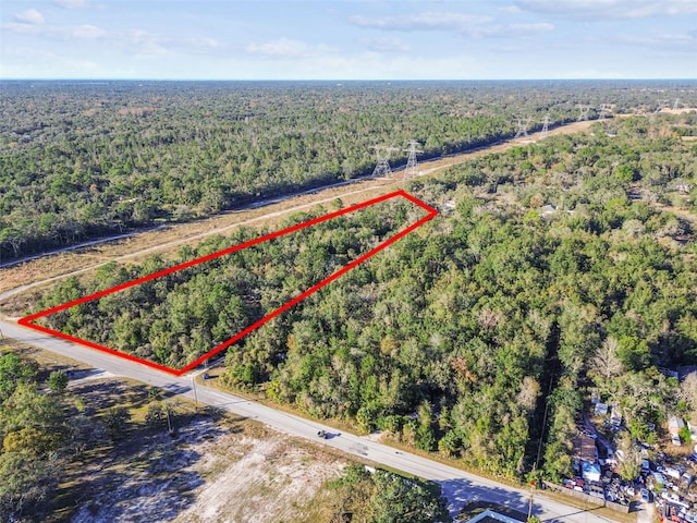 aerial view featuring a forest view