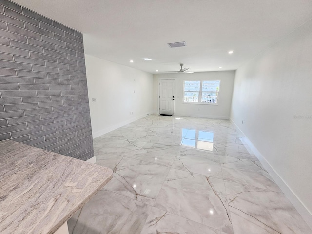 unfurnished room featuring ceiling fan