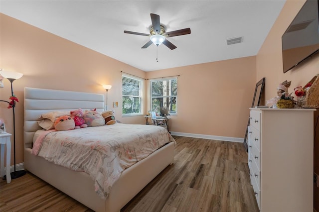 bedroom featuring ceiling fan and light wood-type flooring