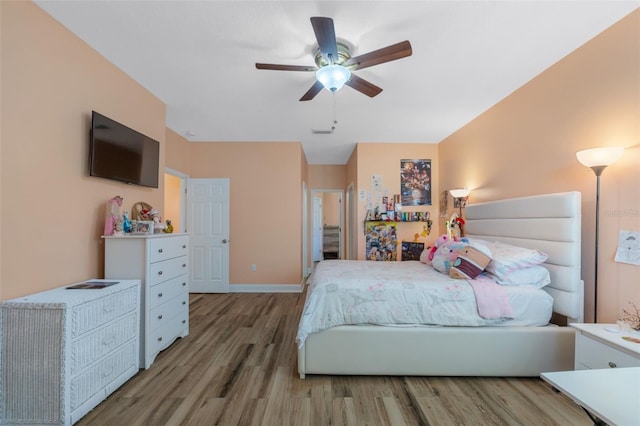 bedroom featuring wood-type flooring and ceiling fan