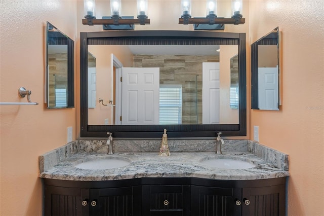 bathroom featuring vanity and an enclosed shower