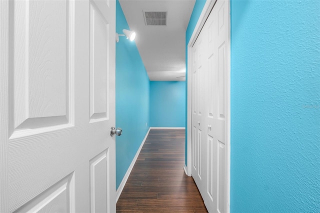 corridor with dark wood-type flooring