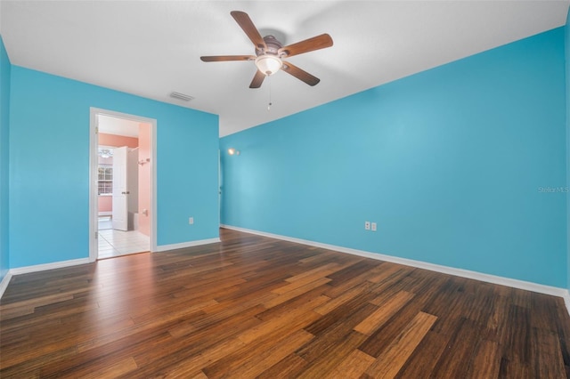 spare room featuring hardwood / wood-style flooring and ceiling fan