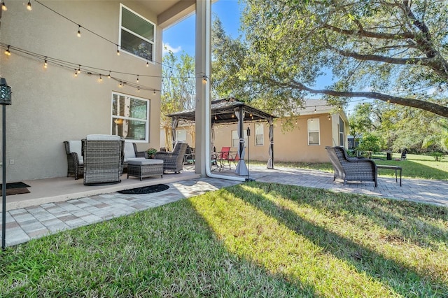 exterior space with a gazebo, a patio area, and a lawn