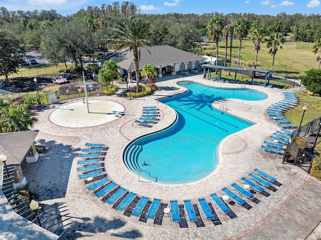 view of swimming pool featuring a patio area