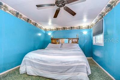 bedroom featuring carpet and ceiling fan