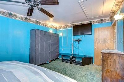 carpeted bedroom with ceiling fan