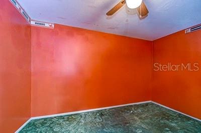 unfurnished room with ceiling fan