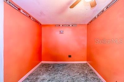 empty room featuring carpet floors and ornamental molding