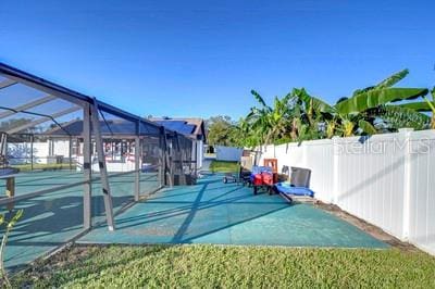 view of patio / terrace with glass enclosure