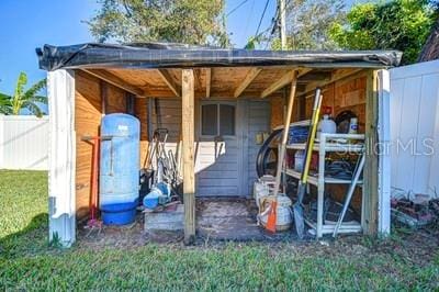 view of outdoor structure with a lawn