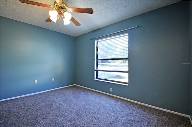 carpeted empty room featuring a textured ceiling and ceiling fan