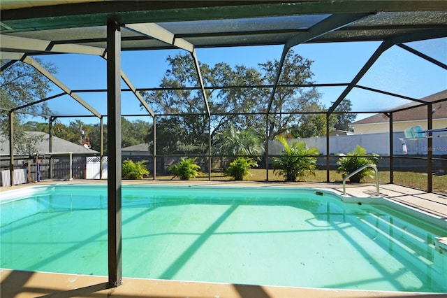 view of pool with a lanai