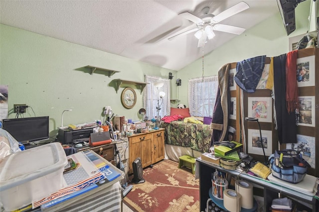 office space with a textured ceiling, ceiling fan, carpet floors, and lofted ceiling